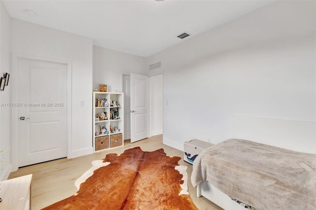 bedroom with light hardwood / wood-style flooring