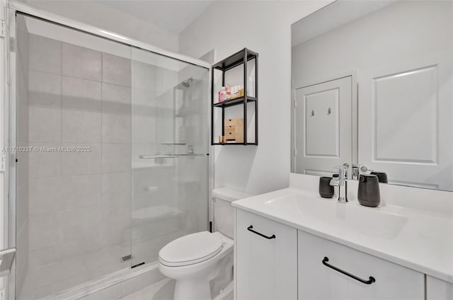 bathroom with walk in shower, vanity, and toilet