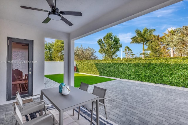 view of patio featuring ceiling fan