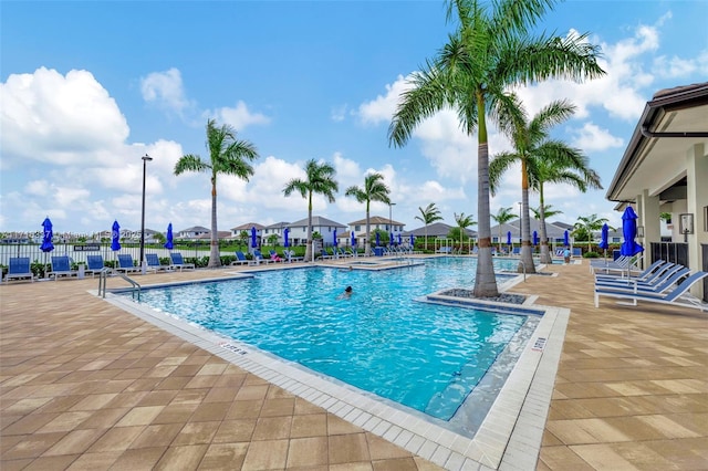 view of swimming pool featuring a patio area