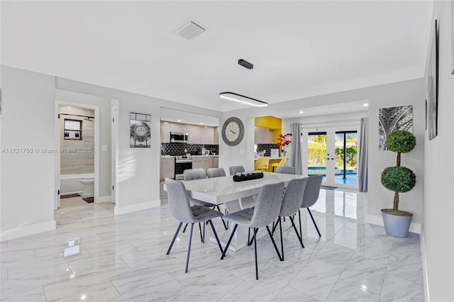 dining space featuring french doors