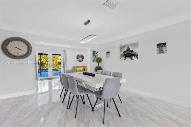 dining space featuring french doors