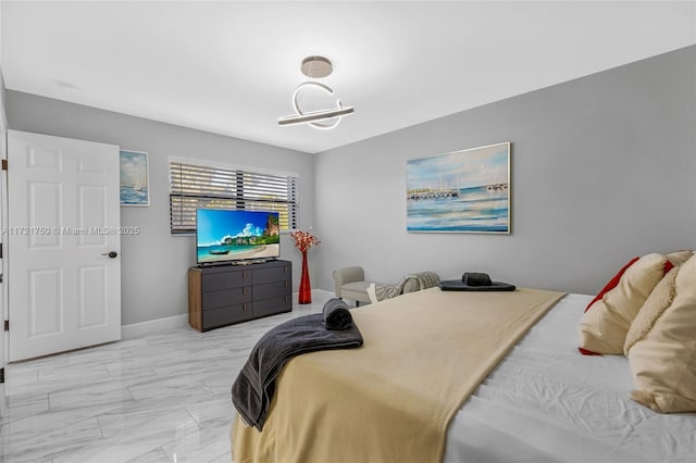 bedroom with an inviting chandelier