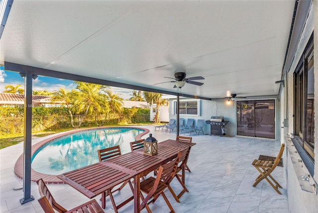 view of patio featuring grilling area and ceiling fan