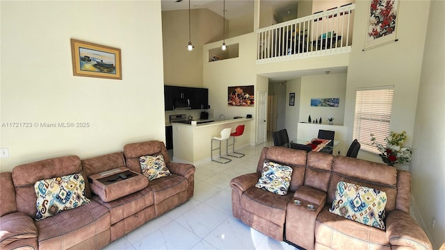 tiled living room featuring a towering ceiling