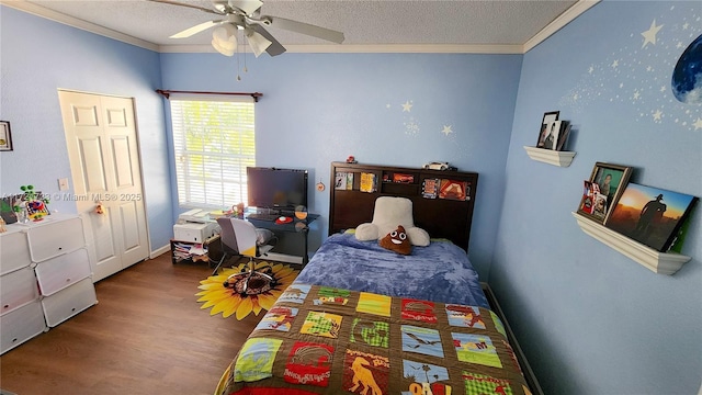 bedroom with a textured ceiling, hardwood / wood-style flooring, ceiling fan, and ornamental molding