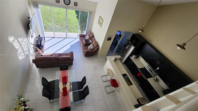 living room with a towering ceiling