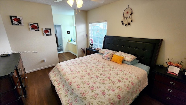 bedroom featuring ceiling fan, dark hardwood / wood-style flooring, and ensuite bathroom