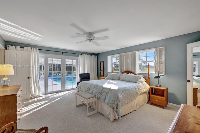 bedroom with ceiling fan, access to exterior, and light carpet