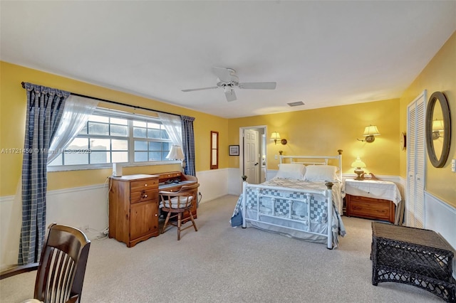 carpeted bedroom with ceiling fan