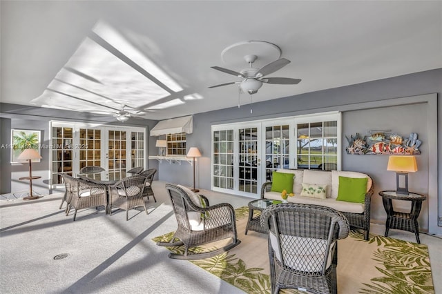 sunroom with ceiling fan and french doors