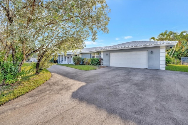 ranch-style home with a garage