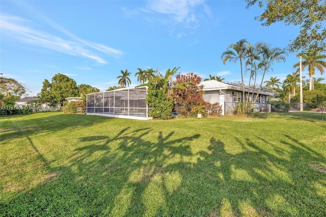 view of yard with a lanai