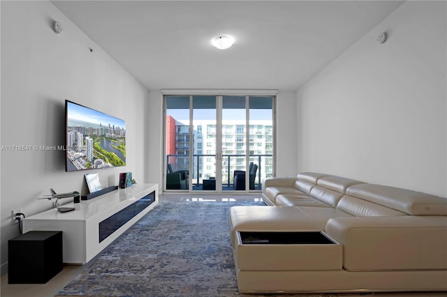 living room featuring floor to ceiling windows