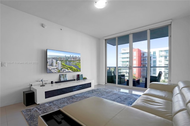 living room with tile patterned flooring and floor to ceiling windows