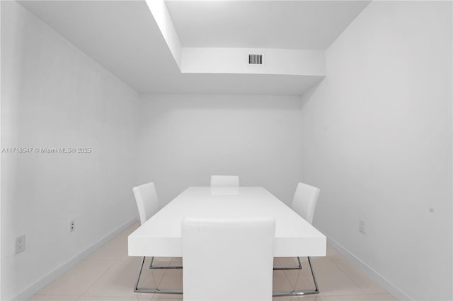 dining area featuring visible vents, baseboards, and light tile patterned flooring