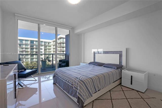 bedroom featuring a view of city, a wall of windows, light tile patterned flooring, and access to exterior