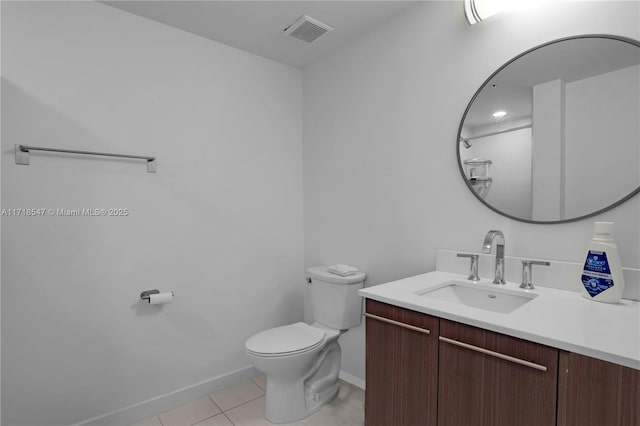 bathroom featuring visible vents, baseboards, toilet, tile patterned flooring, and vanity