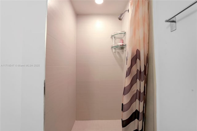 interior space with tiled shower