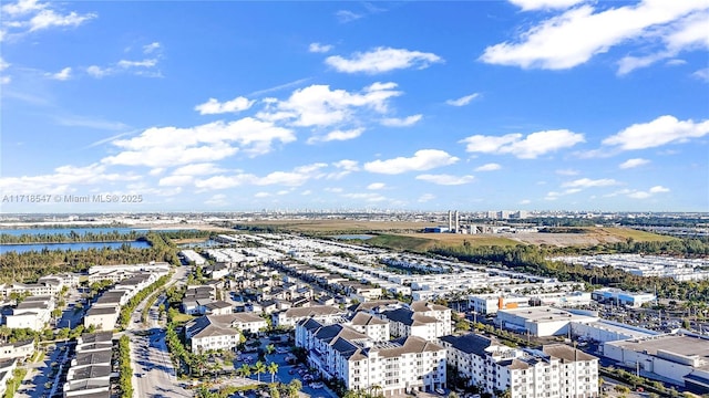 bird's eye view featuring a water view and a city view