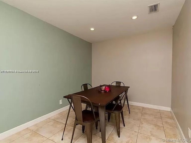 dining space featuring light tile patterned floors