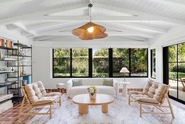 sunroom with vaulted ceiling with beams, wood ceiling, and a wealth of natural light