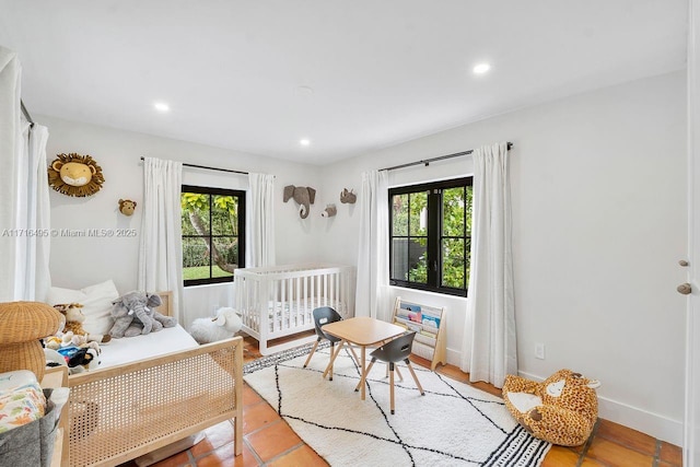 bedroom featuring multiple windows