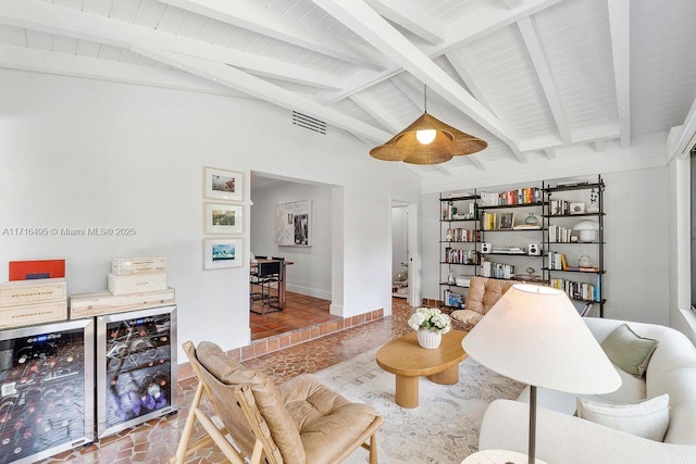 living room featuring wine cooler, vaulted ceiling with beams, and indoor bar