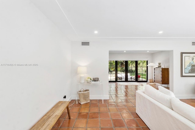 living room with tile patterned flooring and french doors