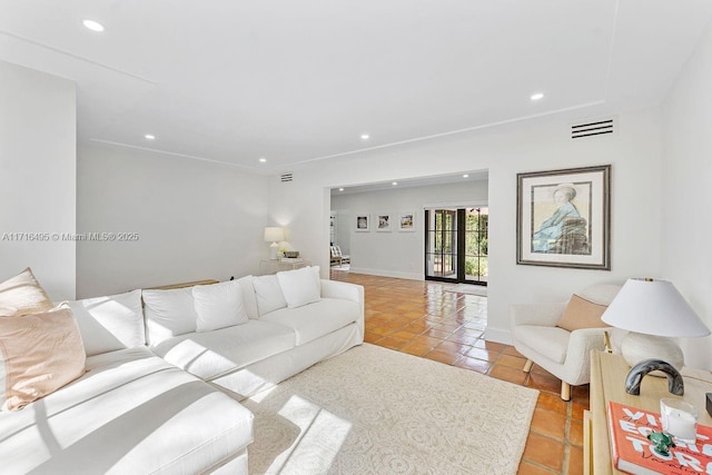 living room with french doors and light tile patterned flooring