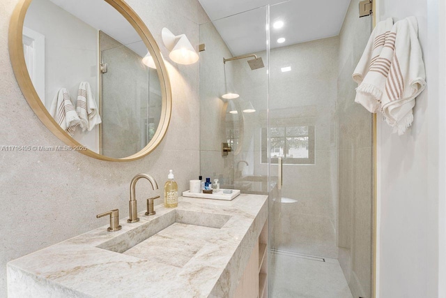 bathroom with vanity and walk in shower