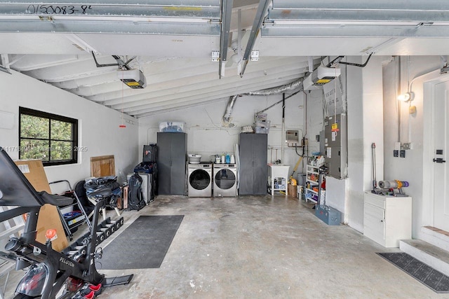 garage with separate washer and dryer and a garage door opener