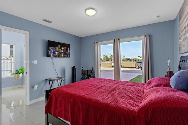 tiled bedroom with access to outside