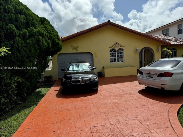 view of side of home with a garage