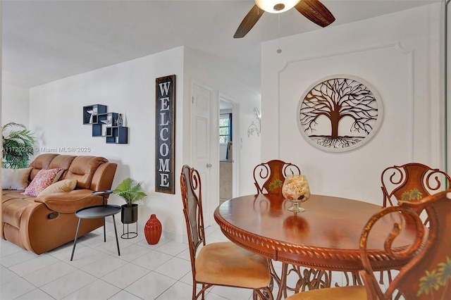 tiled dining space with ceiling fan