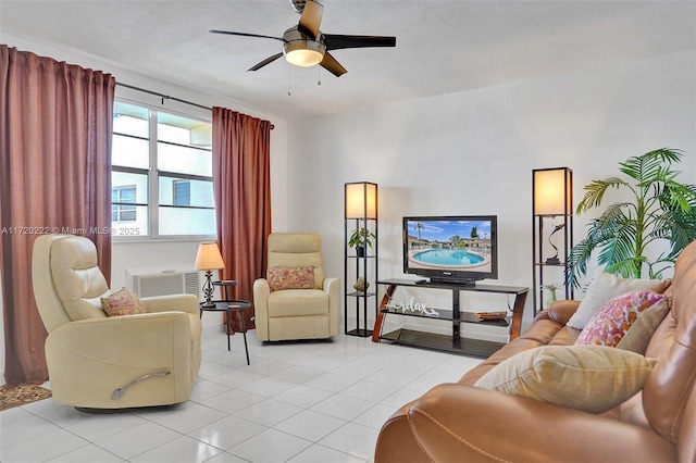 tiled living room with ceiling fan