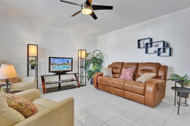 tiled living room featuring ceiling fan