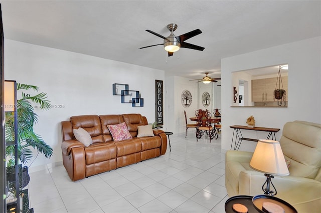 living room featuring ceiling fan and light tile patterned flooring