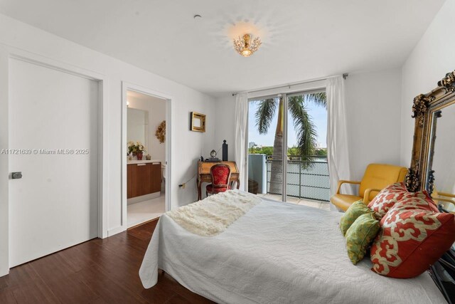 bedroom featuring access to outside, ensuite bath, dark hardwood / wood-style flooring, and expansive windows