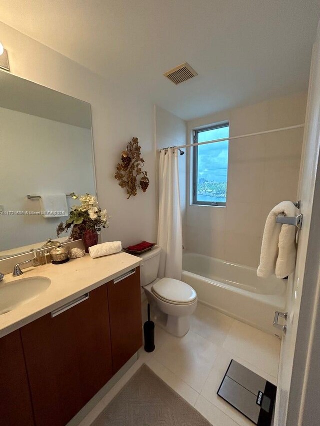 bathroom with shower with separate bathtub, vanity, and tile patterned floors