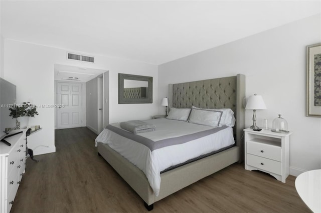 bedroom featuring dark wood-type flooring