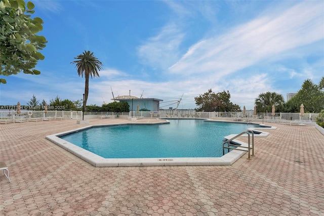 view of swimming pool featuring a patio