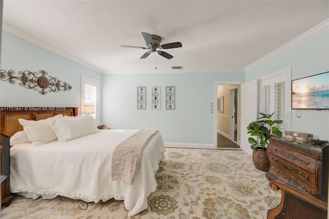 bedroom with ceiling fan and ornamental molding