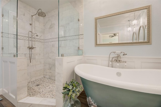 bathroom featuring shower with separate bathtub, a chandelier, and hardwood / wood-style floors