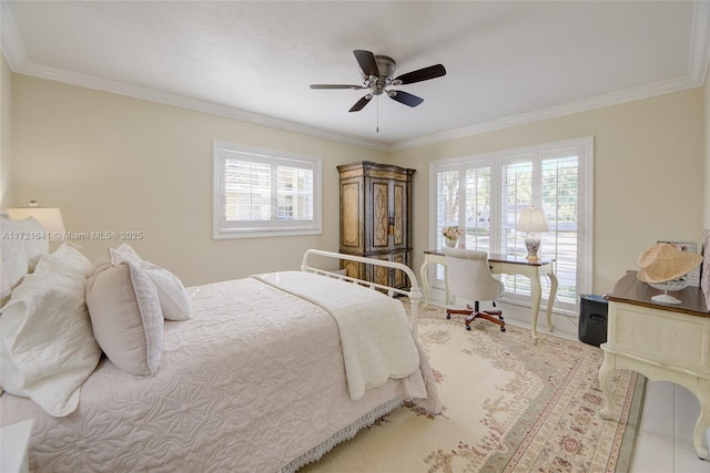 bedroom with ceiling fan and ornamental molding