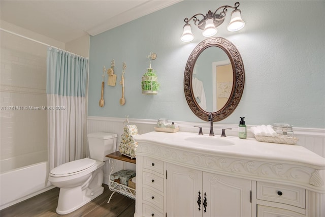 full bathroom with shower / bathtub combination with curtain, hardwood / wood-style floors, toilet, vanity, and ornamental molding