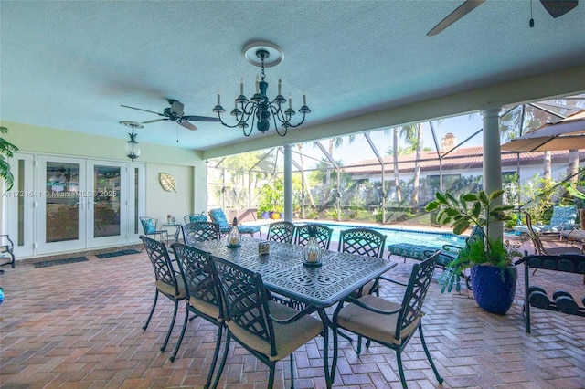 view of patio with ceiling fan, french doors, and glass enclosure