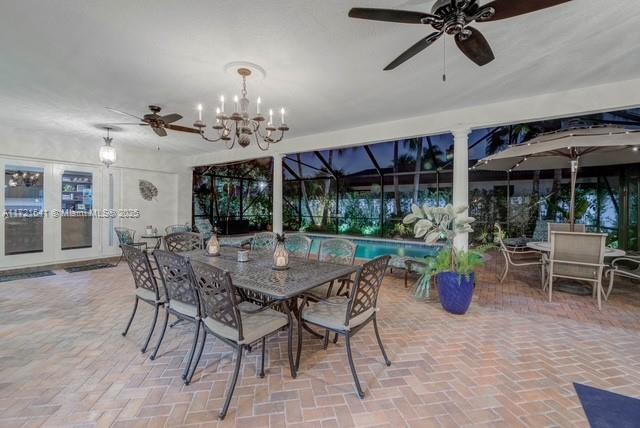 view of patio featuring a lanai