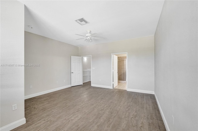 unfurnished bedroom with connected bathroom, ceiling fan, and light hardwood / wood-style floors