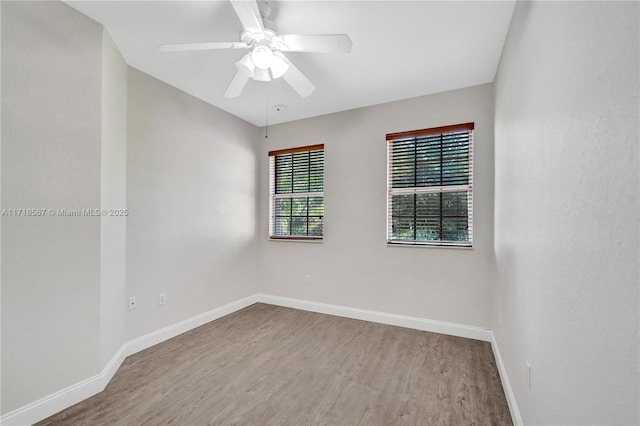 unfurnished room featuring hardwood / wood-style floors and ceiling fan